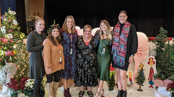 Students dress up and get served a fine meal. 